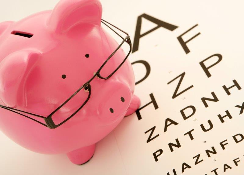 piggy bank with glasses on top of eye chart resized