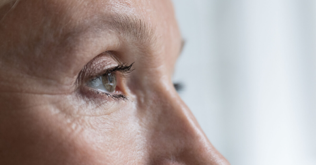 Close up cropped shot, face of senior woman eye looking straight, into distance. Eyesight, ophthalmology clinic advertisement for older, eye-care, disease prevention, vision care and treatment concept